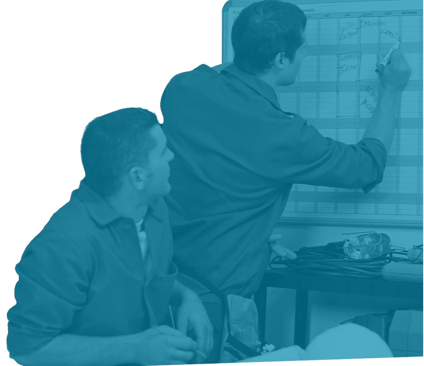 Two maintenance professionals reviewing and updating a scheduling board—illustration from Reliability Academy’s PS100 Planning & Scheduling online training course