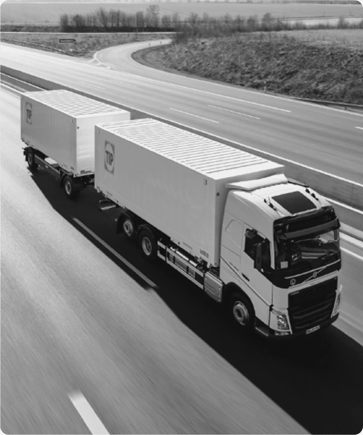 TIP Trailer Services truck with double trailers driving on highway—representing logistics fleet reliability and maintenance success in case study with Reliability Academy